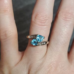 Blue topaz two stone with diamond accent ring